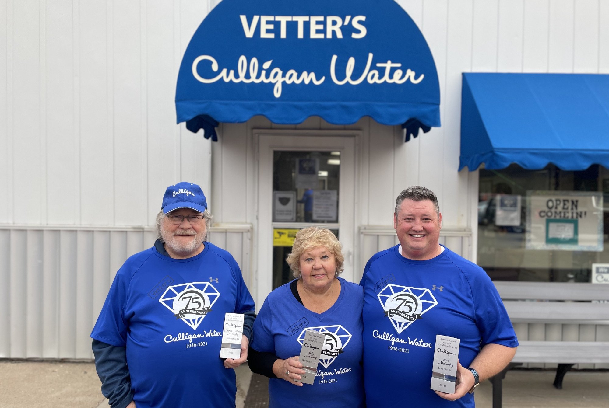 Vetter's Culligan staff posing for photo outside storefront
